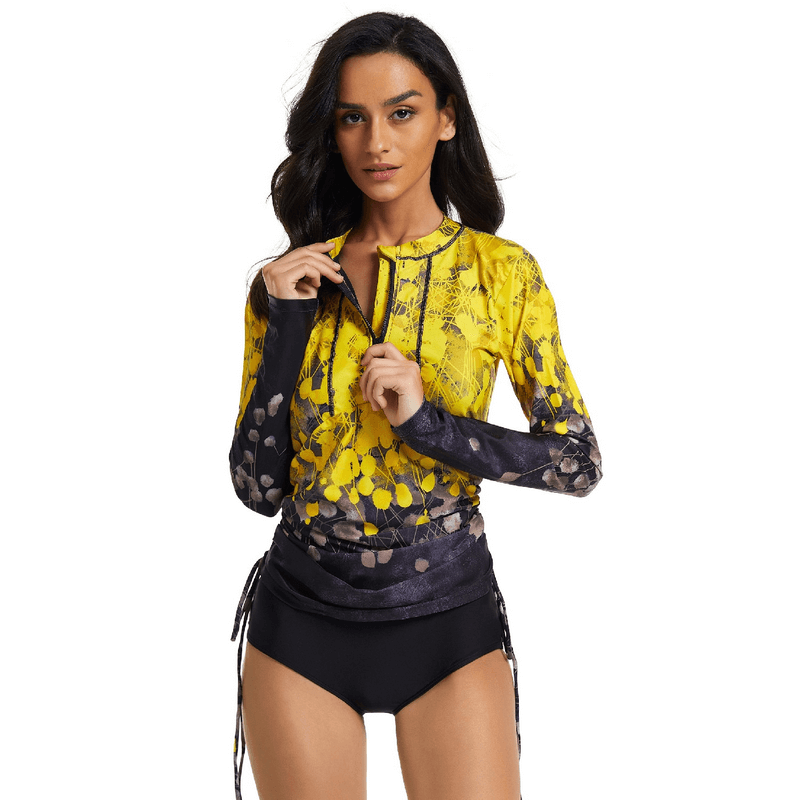 Woman in stylish printed quick-dry swimsuit with unique yellow and black design, showcasing comfort and modern look for swim outings.